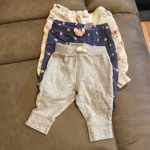 1-blue floral sweat pants, 1- character sweat pants, 1- grey sweat pants